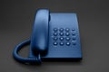 Black office phone toned in blue