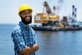 Black offshore worker with digger and ocean Royalty Free Stock Photo
