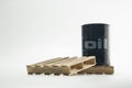 Black oil barrel on wood pallet.