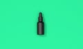 Black oil dropper bottle with blank label on a green background. 3D Render