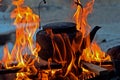 Black old cast iron kettle at stake. hiking, trekking. Royalty Free Stock Photo