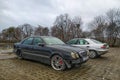 Black old classic vintage veteran wrecked scrap abandoned sedan car Mercedes Benz W210