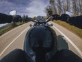 Black old motorbike travelling on a tarmac road driver point of view beautiful landscape