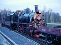 Black old Soviet steam locomotive in the Museum.