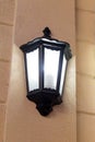 Black old style street lantern on the wall Royalty Free Stock Photo