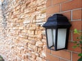 Black old vintage lamp on brick wall