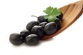 Black olive over wood spoon