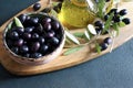 Black olives, olive oil and olives branch. Royalty Free Stock Photo