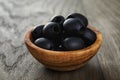 Black olives from can in bowl on table Royalty Free Stock Photo