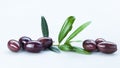 Black Olives with Green Leaves Composition Isolated On White Background Royalty Free Stock Photo