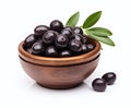 Black olives with leaves in a bowl isolated on a white background Royalty Free Stock Photo