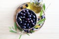 Black olives, olive oil and olives branch. Royalty Free Stock Photo