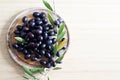 Black olives, olive oil and olives branch. Royalty Free Stock Photo