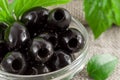 Black olives, pitted marinated in a glass bowl Royalty Free Stock Photo