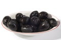 Black olives in a white bowl close up Royalty Free Stock Photo