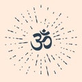 Black Om or Aum Indian sacred sound icon isolated on beige background. Symbol of Buddhism and Hinduism religions. The Royalty Free Stock Photo