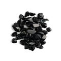 Black onyx pebbles isolated, polished hematite gem stones