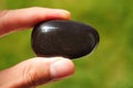 Black Onyx rock from China held in a hand