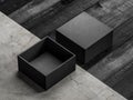 Black opened Box Mockup on wooden and concrete floor Royalty Free Stock Photo