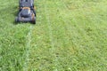 Black and Orange Lawn Mower and Fresh Cut Grass
