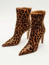 Leopard high heel ankle boot on white background.