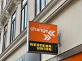 Black and orange sign on the facade of the building. Caption: Western Union, interchange Royalty Free Stock Photo