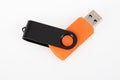 Black orange USB memory flash drive on white background Royalty Free Stock Photo