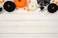 Black, orange and white Halloween top border over white wood Royalty Free Stock Photo