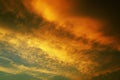 Black orange yellow sunset. Evening sky with clouds. Dark and dramatic. Before the storm. Background with space for design. Royalty Free Stock Photo