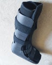 A black Orthopedic or medical boot, cast or footwear