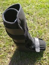 A black Orthopedic or medical boot, cast or footwear