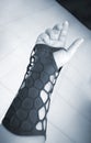 Black orthopedic plastic prosthesis printed on 3D printer on hand.
