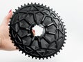 Black oval chainring in woman hand