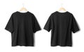 Black oversize T shirt mockup hanging isolated on white background with clipping path.