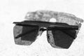 Black Oversized sunglasses shoot in a summer day closeup. Selective focus