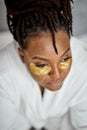 Black Overweight Woman In Bathrobe Solves Under Eyes Facial Problems Applies Patches To Reduce Dark Circles