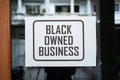 Black owned business sign on the window