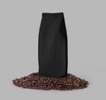 Black packaging mockup on coffee beans, isolated on background, close up Royalty Free Stock Photo