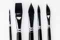 Black painting brushes heads close up view Royalty Free Stock Photo