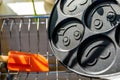 Black pancake smile frying pan on plate drainer rack in kitchen Royalty Free Stock Photo