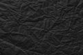Black paper background, crumpled template texture for inserting text