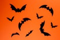 Black paper bats on horizontal orange background Royalty Free Stock Photo