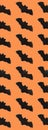 Black Paper Bats on orange background. Halloween concept. Banner for web design. Flat lay, top view, copy space, mockup Royalty Free Stock Photo