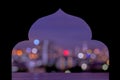 Black paper cut in mosque shape with colorful city bokeh light background.