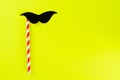 Black paper mustache with copy space for text on yellow background.