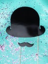 Black paper mustache, hat Mock up against green mint background, Copy space Top view Gentleman card, Fathers Day concept Royalty Free Stock Photo