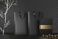 Black paper shopping bag with handles and luxury black box Mock Up. Premium black package for purchases mockup on a Royalty Free Stock Photo