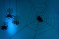 Black paper spider with web on dark blue background. Halloween concept. Royalty Free Stock Photo