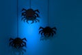 Black paper spider with web on dark blue background. Halloween concept. Royalty Free Stock Photo