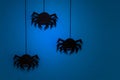 Black paper spider with web on dark blue background. Halloween concept. Royalty Free Stock Photo